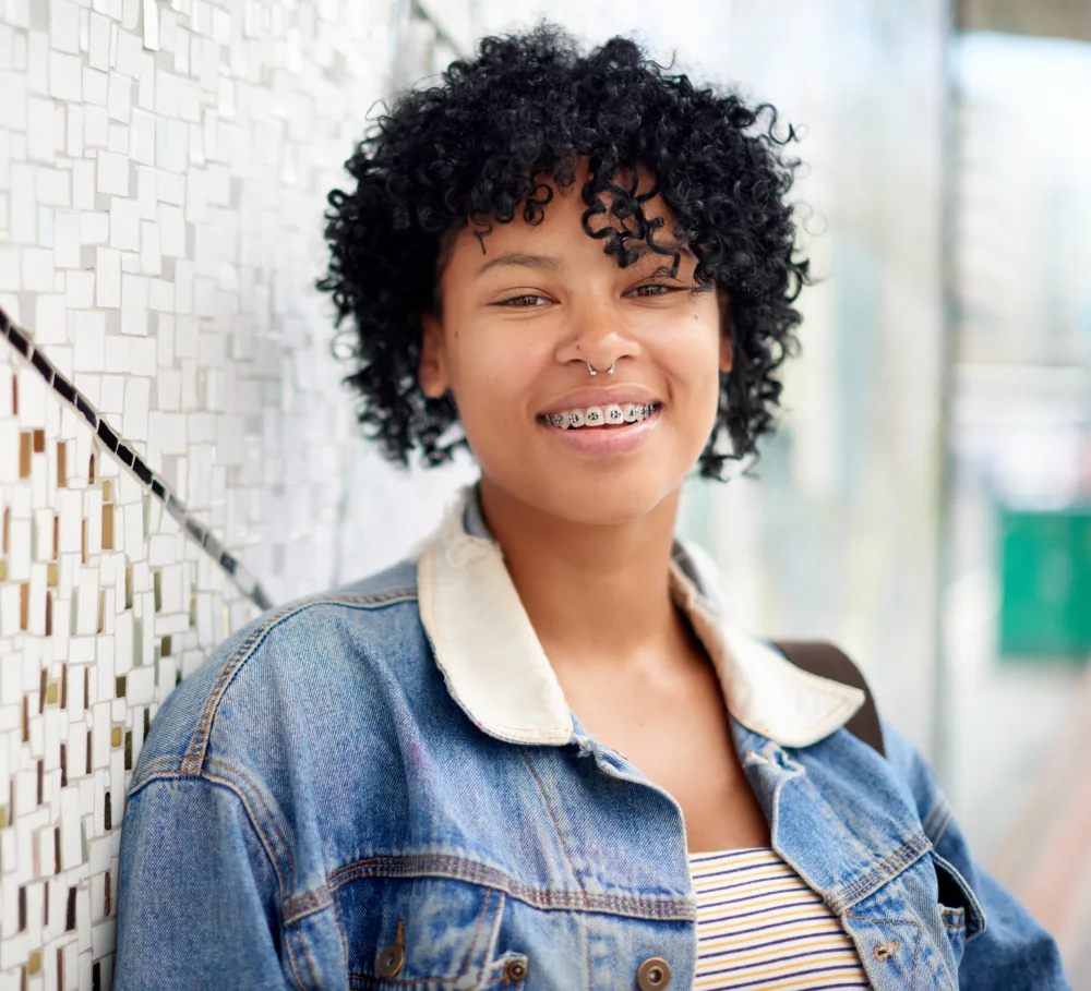 An adult smiling with braces
