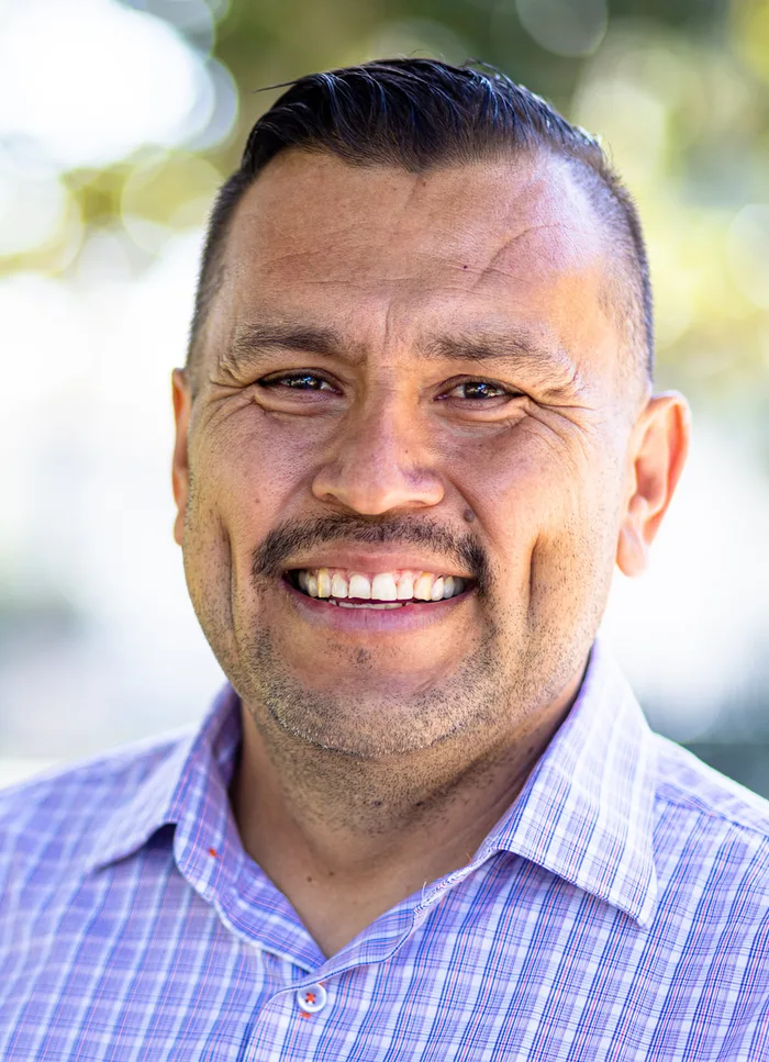 A smiling adult man