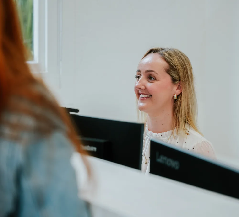 Patient chatting with reception at Auckland City Orthodontics