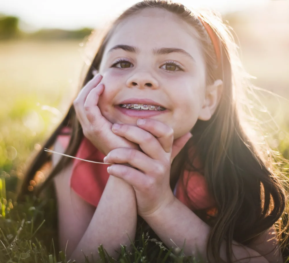 A girl smiling with braces