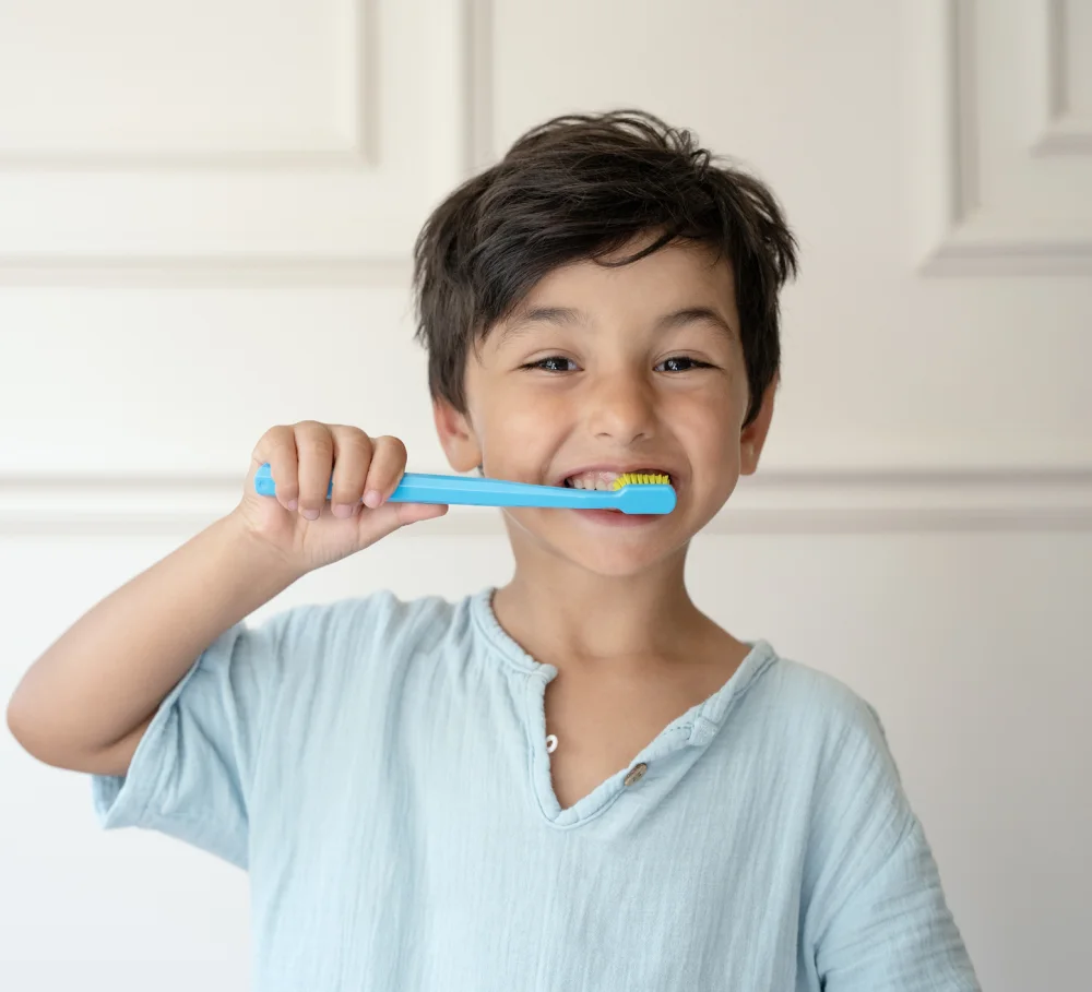 A child brushing their teeth