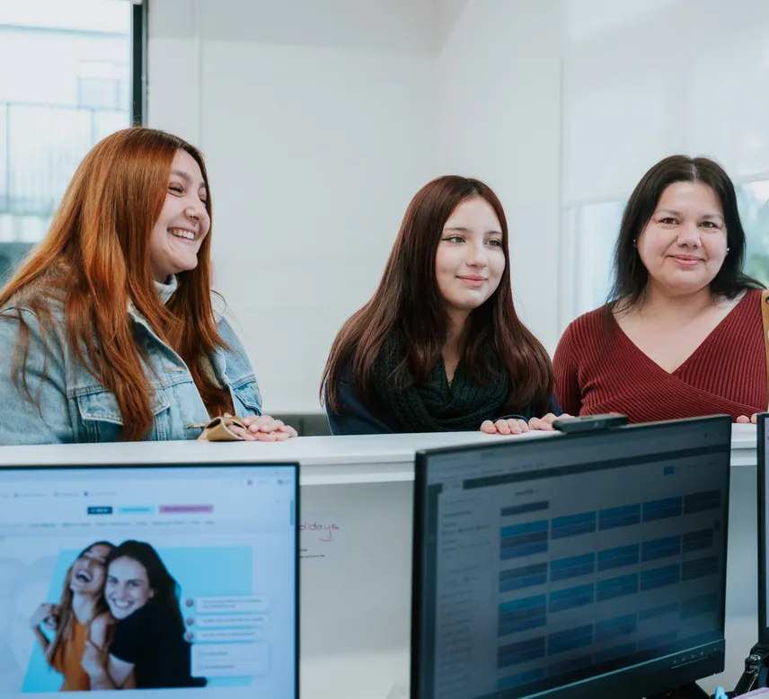 Patients smiling at the reception desk at Auckland City Orthodontics