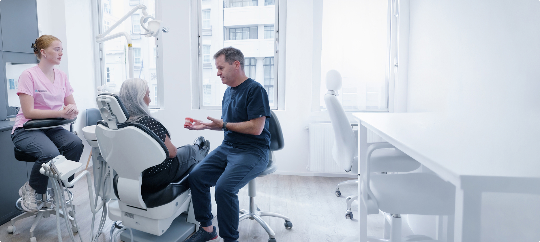 Orthodontist discussing treatment with a patient in the clinic